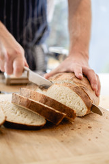 Chef cutting fresh home made bread