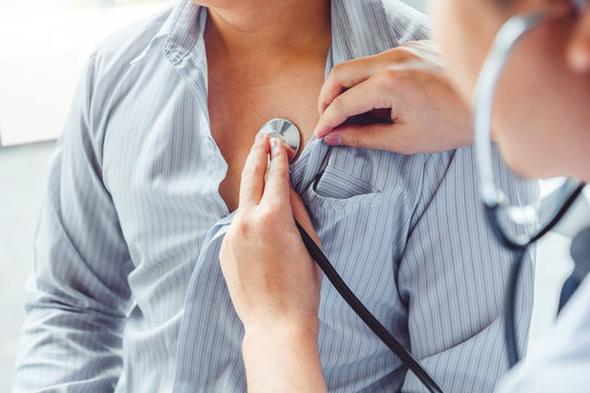 Doctor Measuring arterial blood pressure man patient Health care in hospital