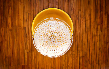 Lamp hang on wooden ceiling, textured background.