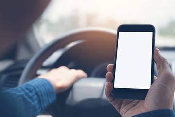 man using smartphone inside a car