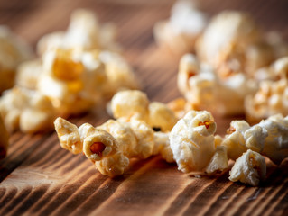 Popcorn flakes on a wooden background