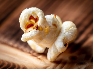 Popcorn flakes on a wooden background
