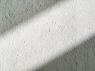 Drop shadow on old white concrete wall. 