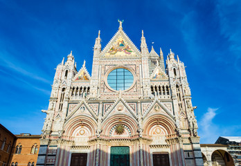 Fototapeta na wymiar Siena Cathedral at a bright sunny day, in Siena, Italy.