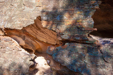 Crack and two grooves in the wall of sandstone cliffs. Sandstone Caves, Pilliga National Park, NSW, Australia.