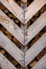 close-up wooden fence for chopped firewood.