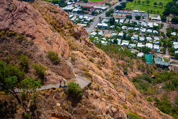 Scenic view from the Castle Hill Lookout at Townsville (Queensland, Australia) down to the town and to the pathway on the mountain's slope.