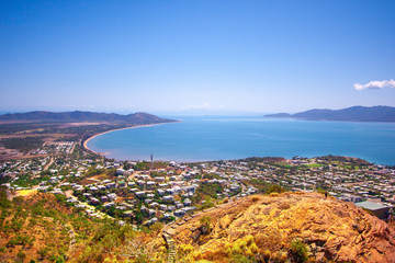 Scenic view from the Castle Hill Lookout at Townsville (Queensland, Australia) to the town, coast line and Magnetic Island. S-shape line of coast.