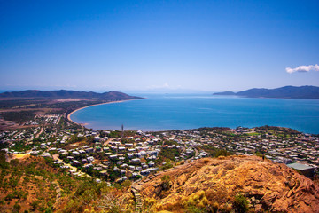 Scenic view from the Castle Hill Lookout at Townsville (Queensland, Australia) to the town, coast line and Magnetic Island. S-shape line of coast.