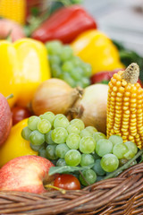 Fresh fruits and vegetables in basket as source healthy vitamins and minerals