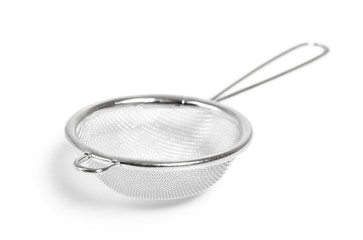 Tea strainer (small sieve) with handle. Isolated with clipping path. - obrazy, fototapety, plakaty