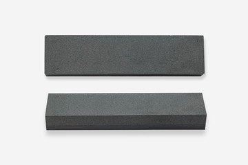 Sharpening stones, or whetstones on white background.