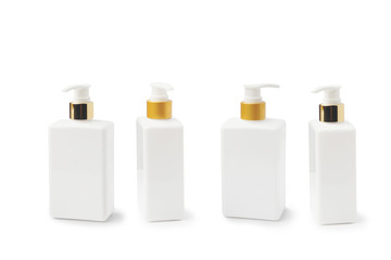 Cosmetic or Shampoo Bottle With Dispening Pump ,Shiny gold and matte plastic Press lotion pump head on white background