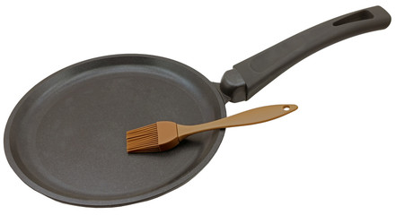 Silicone brush and cast iron frying pan