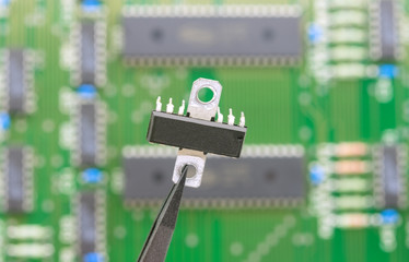Electronic component held with tweezers