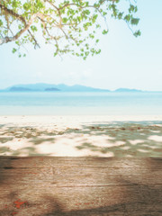 Empty wooden with tree and tropical beach background.