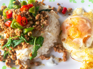 Popular Thai Food one dish meal from Fried Basil Pork Topping it with a crispy fried egg is a delicious for lunch or dinner.