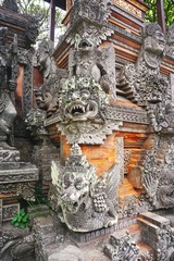 Decorative carved stone deity demon guardian statues outside a Hindu temple in Bali Indonesia