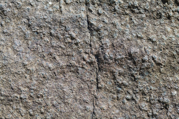 A stone with splashes and a crack for the background.