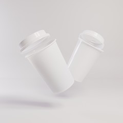 Two paper cups with lids. Template for advertising drinks. Bright background. 3D rendering.