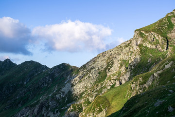 Sunrise on Fagaras high mountain ridge. Romanian mountain landscape with high peaks over 2200m