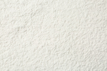 Pile of organic flour as background, top view