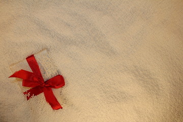 Fototapeta na wymiar beautiful gift on a white background lies in Styrofoam balls