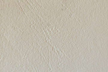 texture of white painted stucco wall closeup