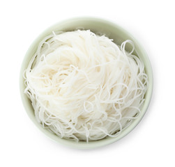 Bowl with rice noodles isolated on white, top view