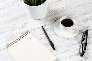 Still life of office workspace with cup of coffee