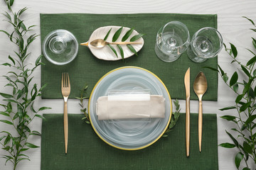 Elegant festive setting on white wooden table, flat lay