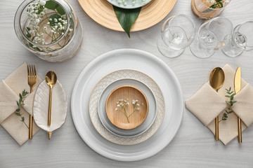 Elegant festive setting on white wooden table, flat lay