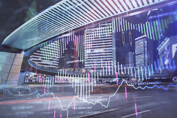 Forex chart on cityscape with tall buildings background multi exposure. Financial research concept.