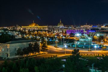 Night view of the presidential palace (Oguzhan) in Ashgabat Turkmenistan - obrazy, fototapety, plakaty