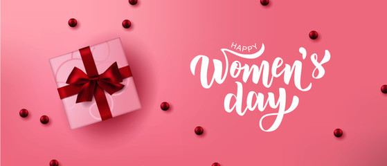 Fototapeta na wymiar Happy Woman’s Day hand lettering text with realistic gift boxes. Vector illustration. 8 March greeting calligraphy design. Template for a poster, cards, banner.