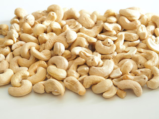 Cashew nuts as a background, texture and pattern. Healthy nuts on white background