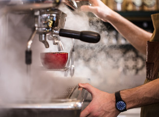 Barista is making coffee