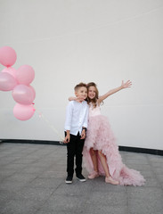 young happy boy and girl together outside