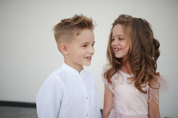 young happy boy and girl together outside