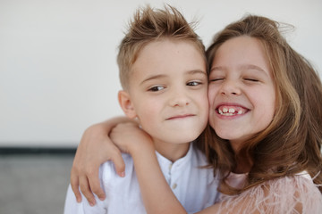 young happy boy and girl together outside
