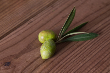 olives with branch on wood