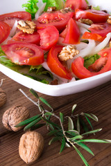 Vegetable salad with nuts and olives, diet and health concept