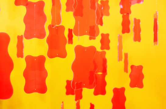 Red Gummy Bears On Yellow Background