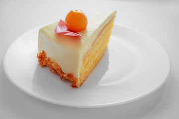 Chocolate cake with physalis fruits, cream, nuts and mousse