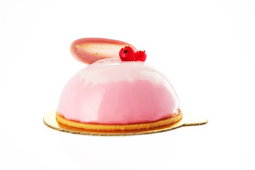 Mousse cake with strawberry puree, cream and fresh fruits on wooden blue background