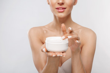 Skin Care Product. Closeup Of Woman Hands Holding Face Cream In A Jar. Beautiful Female Hands With Natural Manicure And Healthy Nails Holding Body Lotion. Beauty Concept