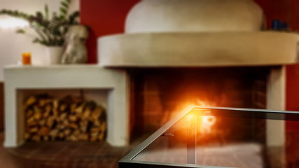 Desk of free space and home interior with fireplace.Valentin Day and warm orange light 