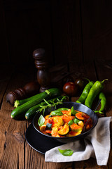 zucchini vegetarian ratatouille with tomato sauce and herbs