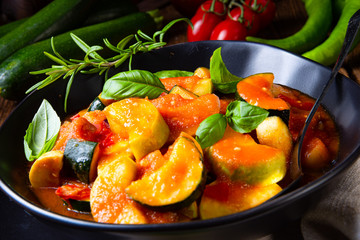 zucchini vegetarian ratatouille with tomato sauce and herbs