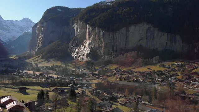 Panoramic view of the scenic Staubbachfalls in the beautiful Lauterbrunnen valley, Switzerland. Aerial tilt up